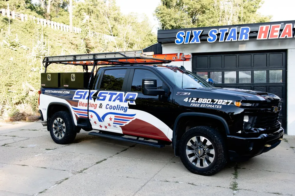 Six Star Heating & Cooling branded truck at the Carnegie shop.