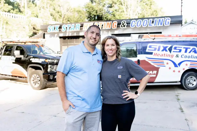The family owners of Six Star Heating & Cooling outside the Carnegie shop.