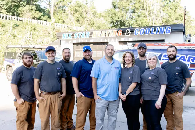 The full Six Star Heating & Cooling team lined up outside the Carnegie shop.