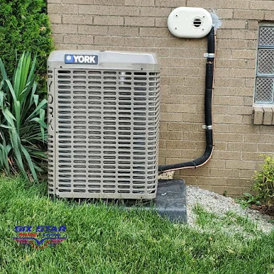 Outdoor YORK HVAC condenser installed by Six Star Heating & Cooling.